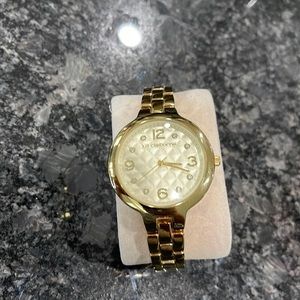 Used Liz Claiborne watch. Shows signs on wear. Needs a new battery